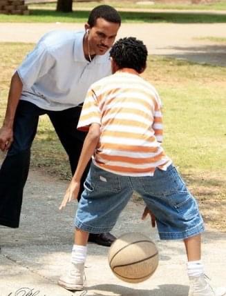 Elder Fordham balling with son.